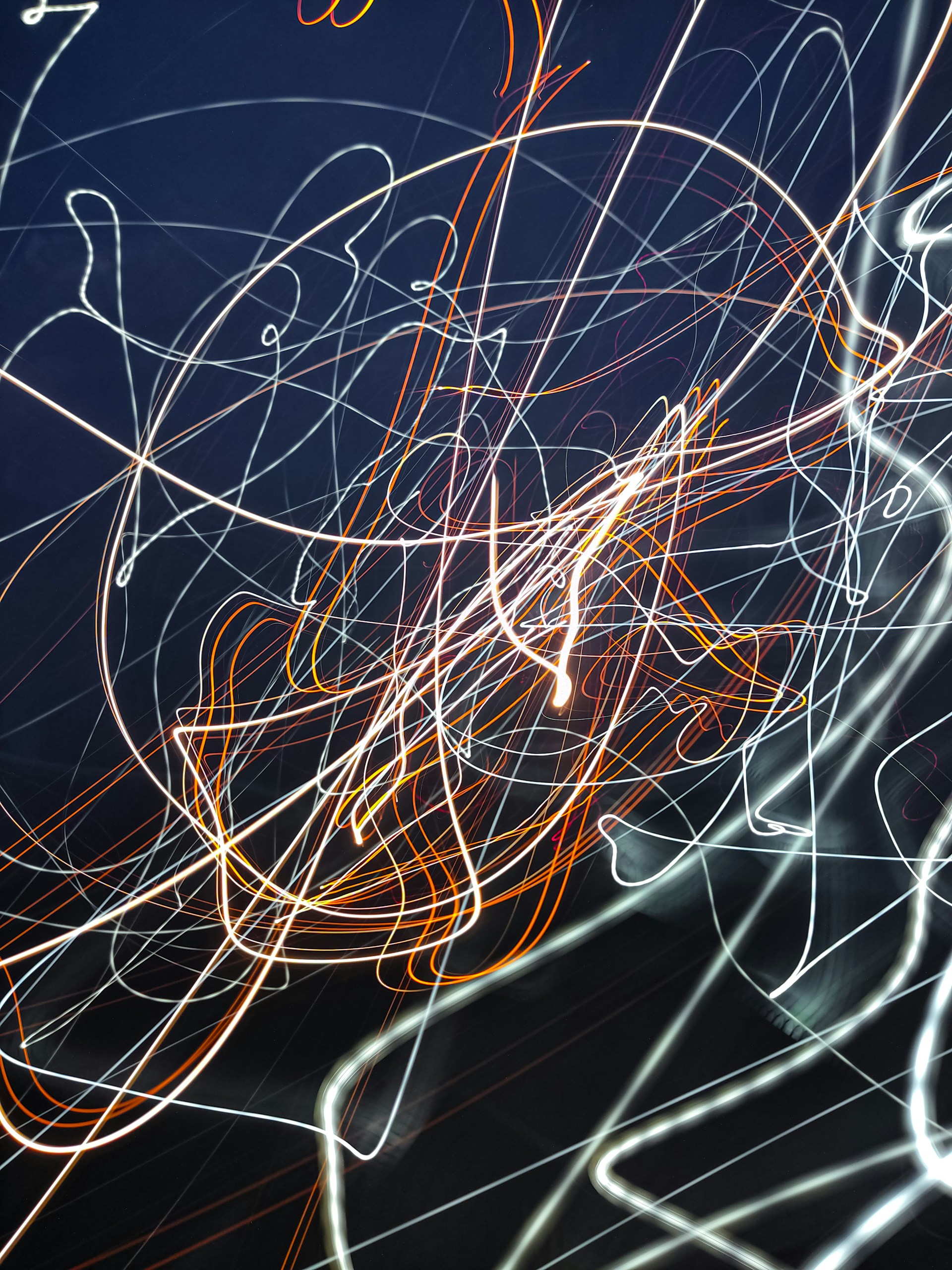 Blurry curves from [Unsplash](https://unsplash.com/photos/a-blurry-photo-of-a-cell-phone-with-a-blue-background-ez16JEglfAo)